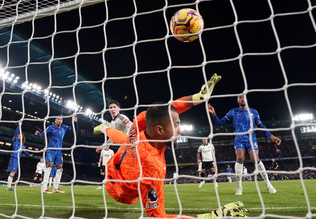 Photo from behind the goal as Chelsea goalkeeper Robert Sanchez is unable to keep out Harry Wilson's shot