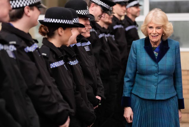 The Queen walking past a line of police officers
