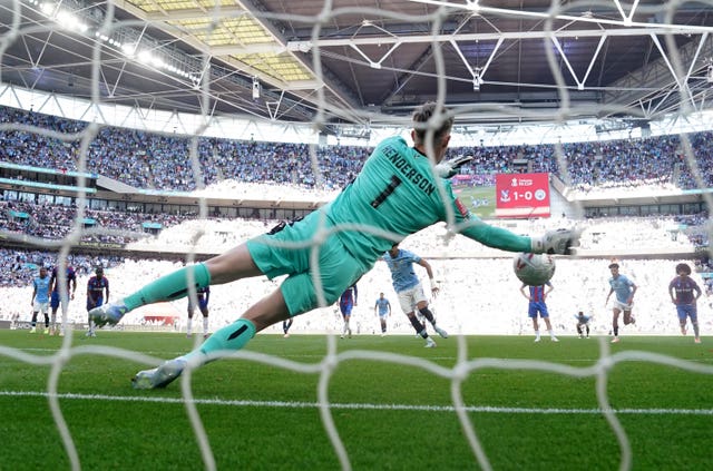 Crystal Palace goalkeeper Dean Henderson saves  Omar Marmoush’s penalty 