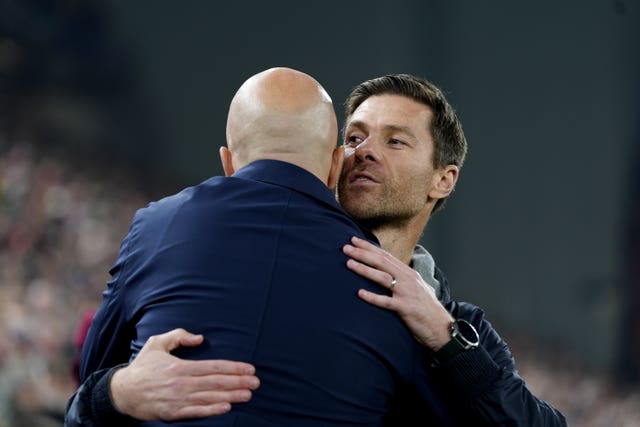 Xabi Alonso hugs Arne Slot