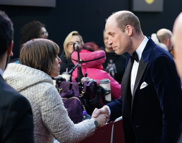William and members of the public on red carpet