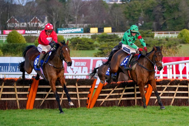 Home By The Lee ridden by jockey JJ Slevin (left) jumps the last hurdle on their way to winning the Jack de Bromhead Christmas Hurdle at Leopardstown  