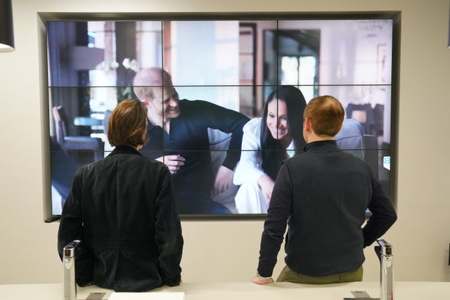 Office workers in London, watching the Duke and Duchess of Sussex’s controversial documentary being aired on Netflix 