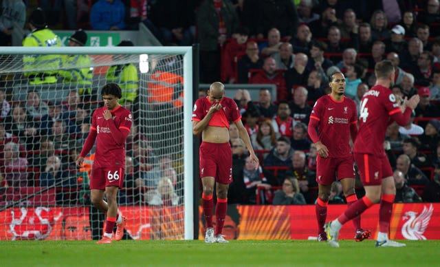 Liverpool’s Trent Alexander-Arnold, Fabinho, Virgil van Dijk and Jordan Henderson, l-r, appear dejected after Tottenham's goal at Anfield