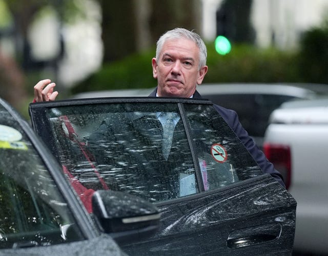 Prof Sir Gregor Smith exiting a car