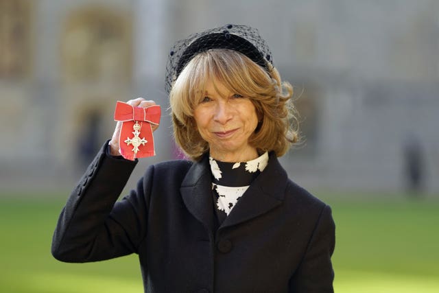 Helen Worth collects her MBE in an investiture ceremony