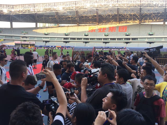 Manchester United players sign autographs in Shanghai during their pre-season tour in 2016