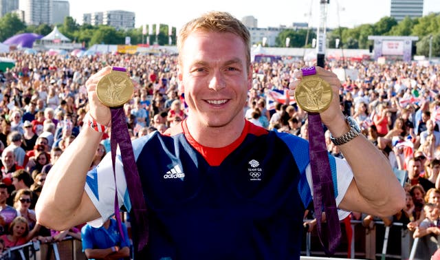 Sir Chris Hoy with his two gold medals from the London Games