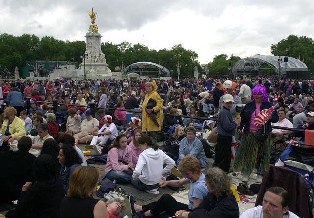 People gather outside Buckingham Palace in 2002 for a concert to celebrate the Golden Jubilee