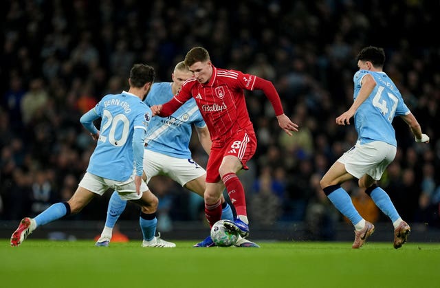Nottingham Forest’s Elliot Anderson (front centre) battles for the ball with Manchester City’s Bernardo Silva (left), Erling Haaland (rear centre) and Phil Foden