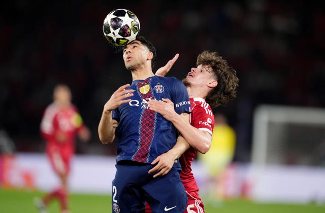 Achraf Hakimi and Milos Kerkez battle for the ball