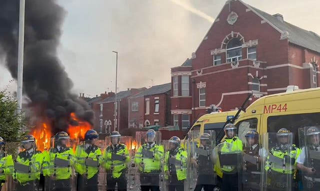 A police van set alight in Southport