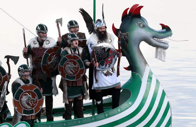 Guizer Jarl John Nicolson cheers whilst on the galley after marching through Lerwick on the Shetland Isles during the Up Helly Aa Viking festival 