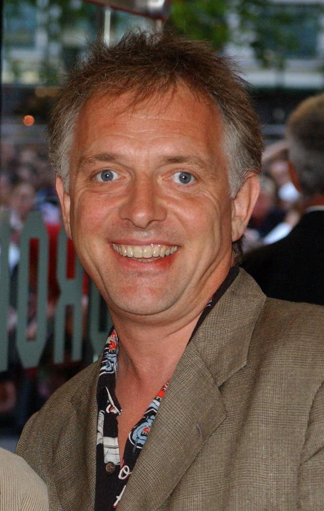 Rik Mayall smiles after arriving at The Odeon Leicester Square for the premiere of Terminator 3: Rise Of The Machines in July 2003