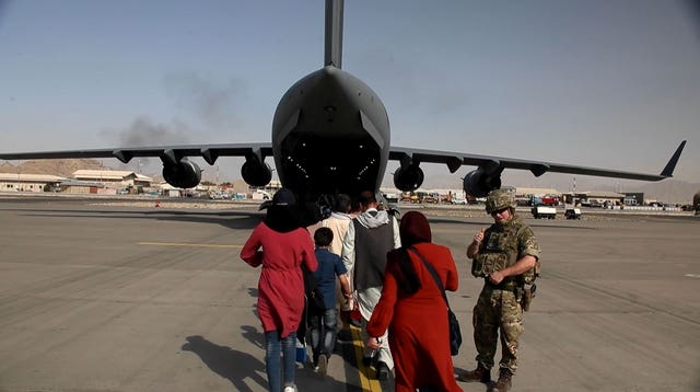 Captain Muraal at Kabul airport as she boards a British military plane to be evacuated to the UK from Afghanistan