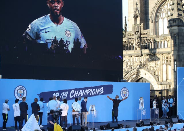 Manchester City’s Vincent Kompany listens to a message from Noel Gallagher