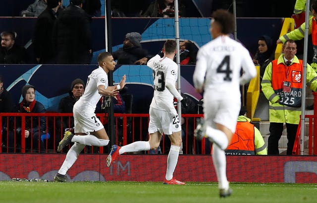 Kylian Mbappe celebrates scoring against Manchester United in the Champions League