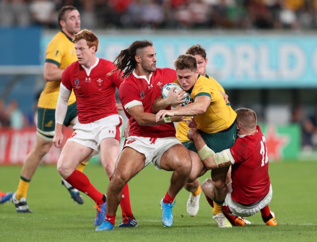 Josh Navidi, pictured tackling Australia’s James O’Connor, has been ruled out of the rest of the World Cup by injury and has been replaced by Owen Lane.