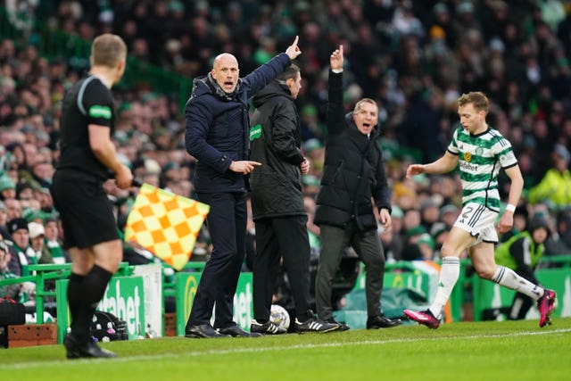 Philippe Clement, centre, and Brendan Rodgers, second right, gesture on the touchline