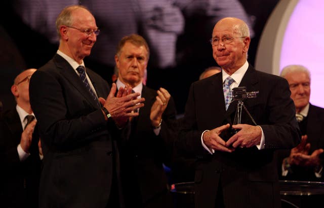 Charlton receives the Lifetime Achievement Award from his brother Jack during the BBC Sport Personality of the Year Awards (David Davies/PA).