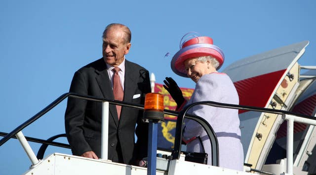 Queen Elizabeth II with the Duke of Edinburgh at Heathrow Airport before boarding a plane ahead of the royal visit to eastern Europe in 2008