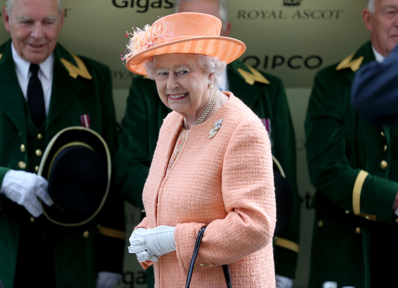 Queen dons gloves at Buckingham Palace investiture Bradford Telegraph