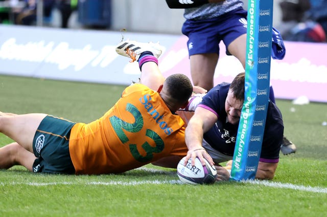 Ewan Ashman (right) scores against Australia 