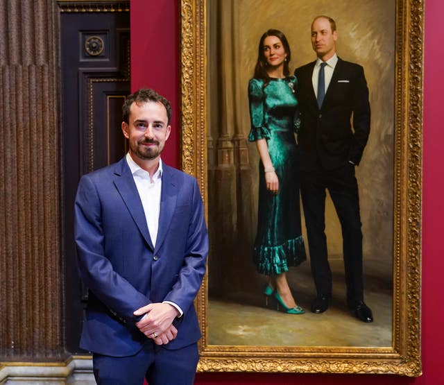 Artist Jamie Coreth in front of a portrait he painted of the Duke and Duchess of Cambridge which is on display at the Fitzwilliam Museum, Cambridge (Paul Edwards/The Sun/PA)
