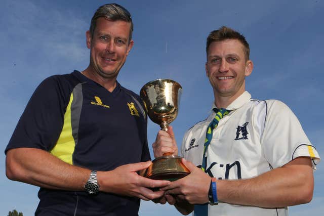 Giles, left, and Warwickshire captain Jim Troughton celebrate winning the County Championship title in 2012