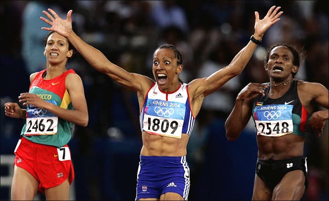 Dame Kelly Holmes, centre, celebrates her 800m win in Athens