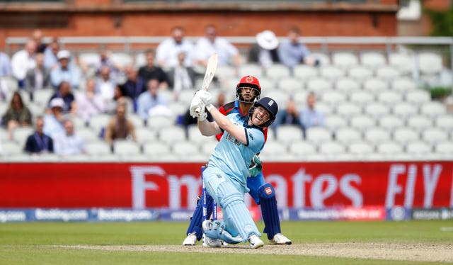 Eoin Morgan and Afghanistan wicketkeeper Ikram Ali Khil keep their eyes on one of the England captain's 17 sixes in the match
