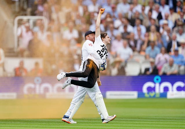 England’s Jonny Bairstow removes a Just Stop Oil protester from the pitch during day one of the second Ashes test match at Lord’s, London, in June. 