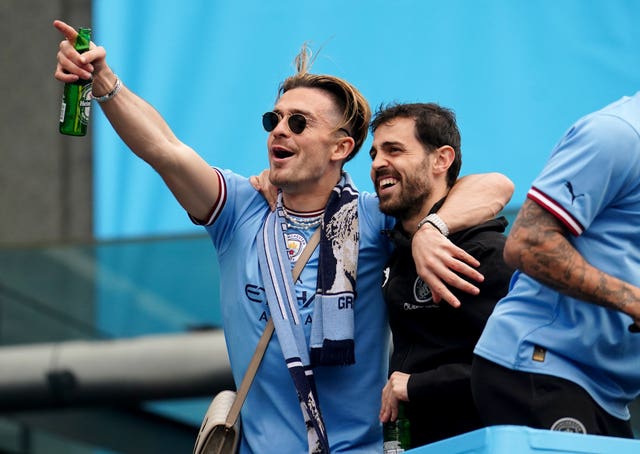 Manchester City’s Jack Grealish celebrates with Bernardo Silva