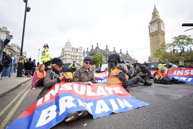 Climate activists from Insulate Britain blocked the road during a demonstration outside the Houses of Parliament (James Manning/PA)