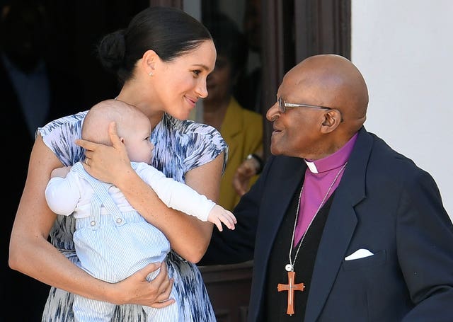 Archbishop Desmond Tutu presented Meghan's son Archie with gifts during their visit to South Africa last year. Toby Melville/PA Wire