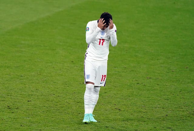 England’s Jadon Sancho stands dejected after missing from the penalty spot in the Euro 2020 final shoot-out loss to Italy