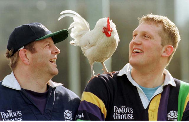 Doddie Weir, right, and Scotland team-mate Damian Cronin pose with a cockerel ahead of a Five Nations game against France