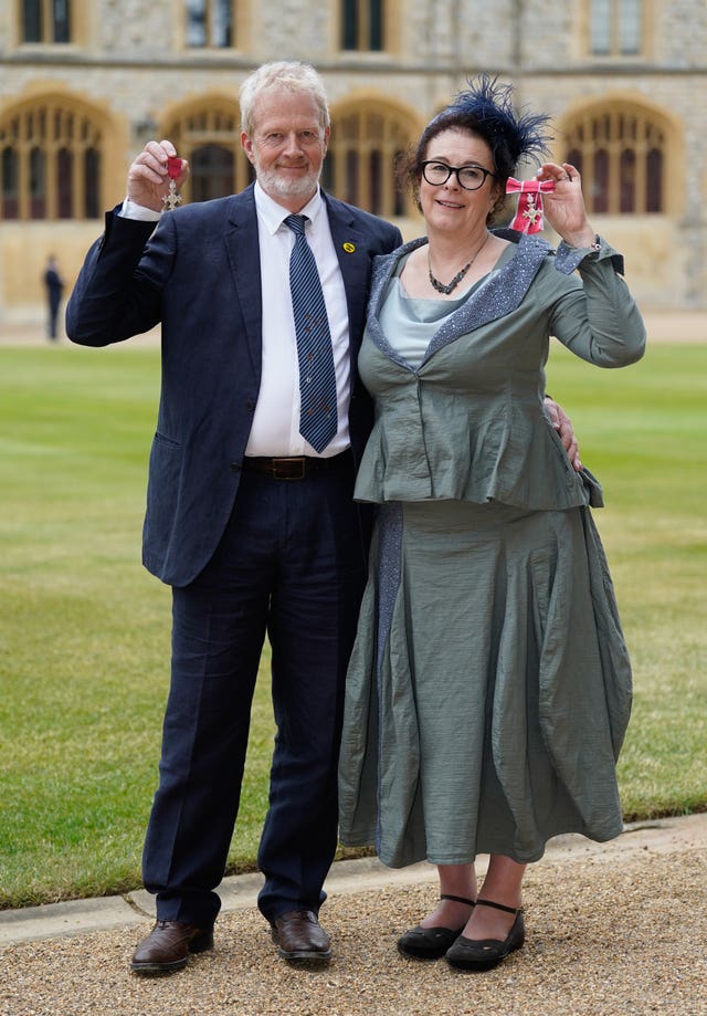 Charles and Elisabeth Ritchie after receiving their Member of the Order of the British Empire medals from the Prince of Wales