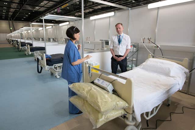 Sir Simon Stevens visited the ExCel centre in London, which is being made into the temporary NHS Nightingale hospital 