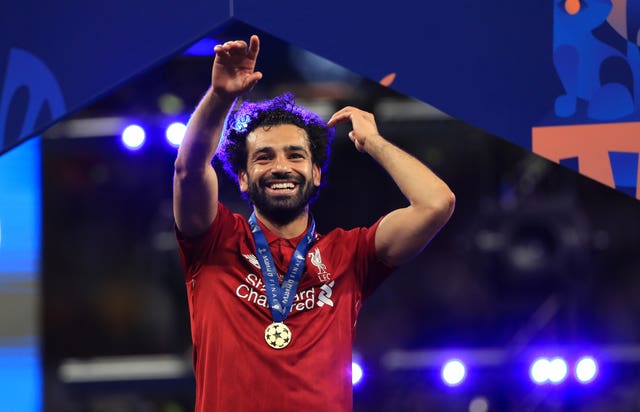 Mohamed Salah celebrates wearing his winner's medal