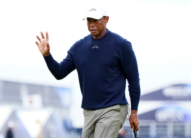 Tiger Woods acknowledges the crowd in the 2024 Open