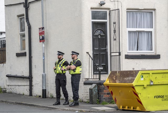 Police outside a house in Harehills