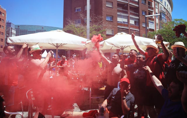 Liverpool fans set off a smoke flare