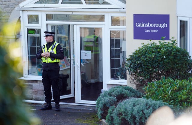 A police officer at the entrance to Gainsborough Care Home in Swanage