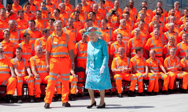 Jubilee Queen: The monarch's fashion staples, wardrobe tricks and style choices 2 Reading Station official opening