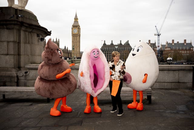 TV presenter Clare Balding with Stand Up To Cancer mascots on Westminster Bridge