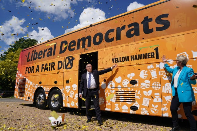 Liberal Democrat leader Sir Ed Davey, with local parliamentary candidate Pippa Heylings, at the launch of his party's election battle bus at Whittlesford, Cambridge. on May 26