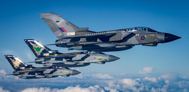 Three specially painted GR4s off the wing of a Voyager flying over the North Sea 