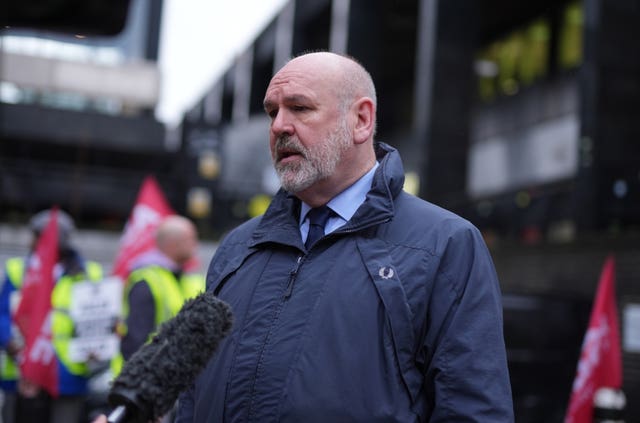 Aslef general secretary Mick Whelan speaks to the media on a picket line at Euston train station in London 