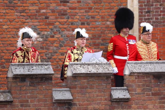 Garter Principle King of Arms, David Vines White (centre) reads the proclamation of new King, King Charles III, from the Friary Court balcony of St James’s Palace (Richard Heathcote/PA)